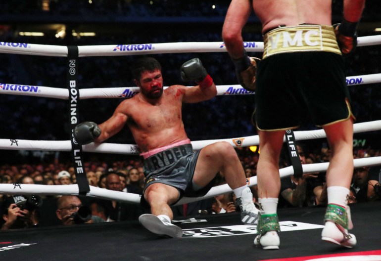 Boxing - Super Middleweight - Saul 'Canelo' Alvarez v John Ryder - Estadio Arkon, Guadalajara, Mexico - May 7, 2023 John Ryder reacts after being knocked down by Saul 'Canelo' Alvarez Reuters/Henry Romero